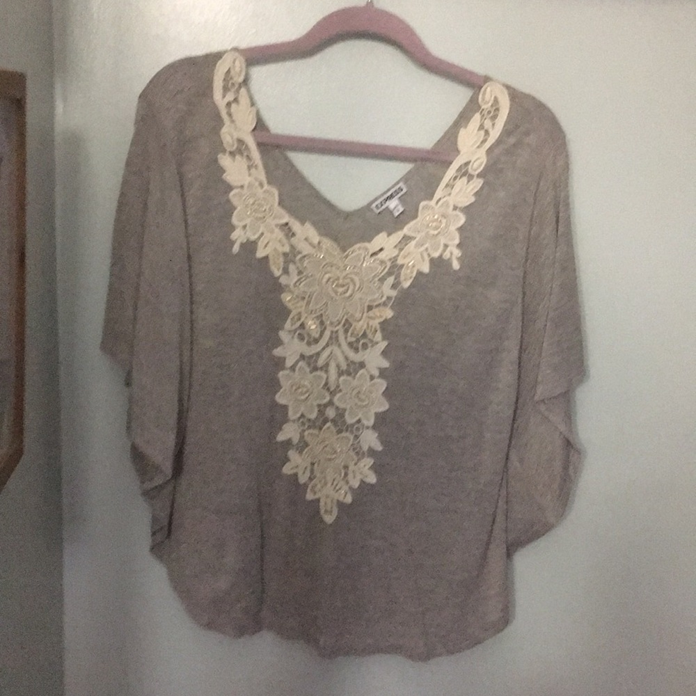 Poncho sweater with crochet detail